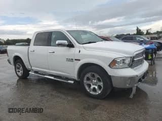✅ 2015 Ram 1500 Laramie • VIN: 1C6RR7NM7FS689086 • Lot: 70006105. Listed on Copart with 147,608 mi. Free auction sales archive from the USA and detailed vehicle history report at DreamBid. Image 1.
