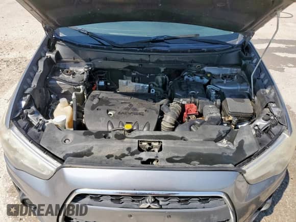 2013 Mitsubishi Outlander ES z VIN 4A4AR3AU7DE002388, wystawiony jako Copart lot #71191145 z przebiegiem 210 627 mil mil oraz Szkoda całkowita • Salvage title. Historia ofert i sprzedaży dostępna na DreamBid. Obrazek 12.