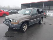 ✅ 1999 Jeep Grand Cherokee Laredo • VIN: 1J4G258S2XC768349 • Lot: 41305102. Listed on IAAI with 136,848 mi. Free auction sales archive from the USA and detailed vehicle history report at DreamBid. Image 2.