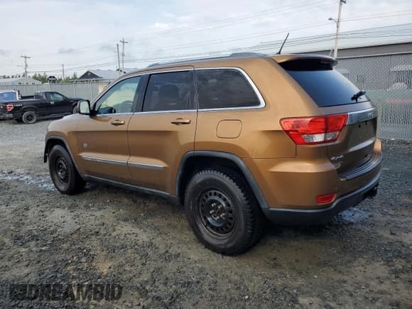 ✅ 2011 Jeep Grand Cherokee Laredo • VIN: 1J4RR4GGXBC697695 • Lot: 59696055. Listed on Copart with 148,537 mi. Free auction sales archive from the USA and detailed vehicle history report at DreamBid. Image 2.