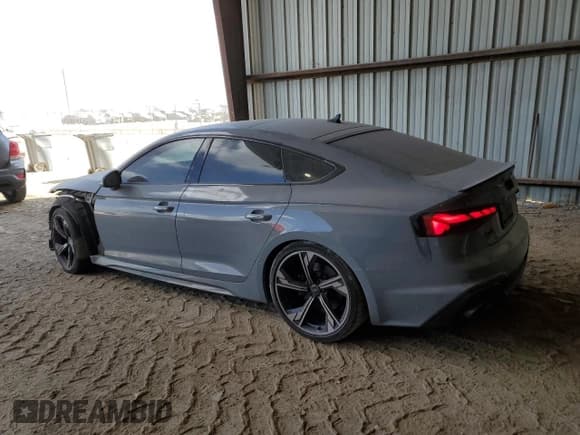 ✅ 2023 Audi RS 5 Sportback • VIN: WUAAWCF57PA903163 • Лот: 77034994. Опубликован ранее на Copart с пробегом 13 115 миль. Бесплатный доступ к архиву аукционных продаж из США и подробный отчёт об истории автомобиля на DreamBid. Изображение 2.