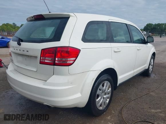 ✅ 2014 Dodge Journey American Value • VIN: 3C4PDCAB2ET247194 • Lot: 42968008. Listed on IAAI with 142,469 mi. Free auction sales archive from the USA and detailed vehicle history report at DreamBid. Image 4.