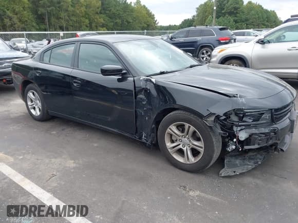✅ 2023 Dodge Charger SXT • VIN: 2C3CDXBG5PH579520 • Lot: 43245472. Listed on IAAI with 59,873 mi. Free auction sales archive from the USA and detailed vehicle history report at DreamBid. Image 1.