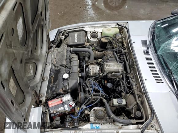 ✅ 1985 Mazda RX-7 • VIN: JM1FB3327F0881937 • Lot: 74971764. Wystawiony na Copart z przebiegiem 271 129 mil. Bezpłatny archiwum sprzedaży aukcyjnych z USA i szczegółowy raport historii pojazdu na DreamBid. Zdjęcie 11.