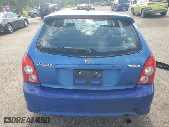 ✅ 2003 Mazda Protege • VIN: JM1BJ245X31173773 • Lot: 66608185. Listed on Copart with Not provided. Free auction sales archive from the USA and detailed vehicle history report at DreamBid. Image 6.