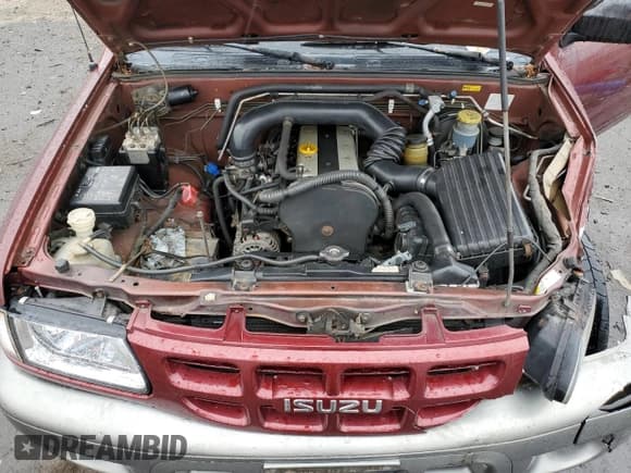 ✅ 2002 Isuzu Rodeo • VIN: 4S2CK58D124323937 • Lot: 86155194. Listed on Copart with 184,491 mi. Free auction sales archive from the USA and detailed vehicle history report at DreamBid. Image 12.