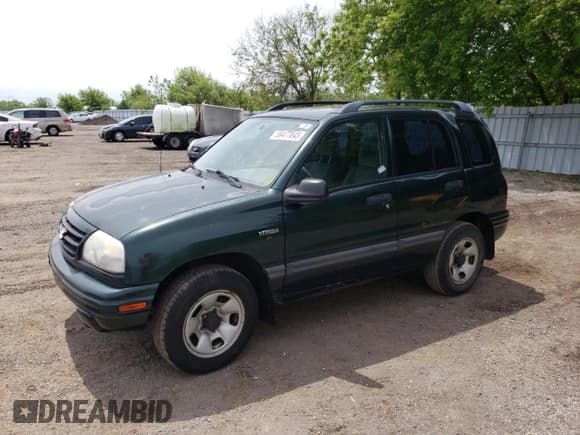 ✅ 2003 Suzuki Vitara JLX • VIN: 2S3TD52V136101732 • Лот: 58477845. Опубликован ранее на Copart с пробегом 105 628 миль. Бесплатный доступ к архиву аукционных продаж из США и подробный отчёт об истории автомобиля на DreamBid. Изображение 1.