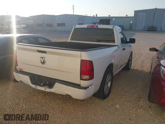 2013 Ram 1500 Express z VIN 3C6JR6AT4DG509071, wystawiony jako IAAI lot #43174479 z przebiegiem 148 276 mil mil oraz . Historia ofert i sprzedaży dostępna na DreamBid. Obrazek 4.