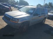 ✅ 2000 Jeep Grand Cherokee Laredo • VIN: 1J4G248S2YC134213 • Lot: 43456750. Listed on IAAI with 242,776 mi. Free auction sales archive from the USA and detailed vehicle history report at DreamBid. Image 2.