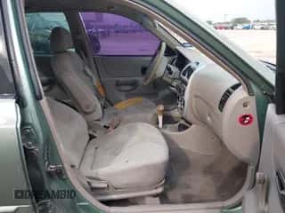 2003 Hyundai Accent GL z VIN KMHCG45C83U477254, wystawiony jako IAAI lot #42621015 z przebiegiem 71 966 mil mil oraz . Historia ofert i sprzedaży dostępna na DreamBid. Obrazek 5.