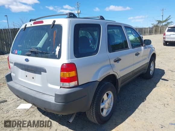 ✅ 2003 Ford Escape XLS Popular • VIN: 1FMYU92193KE09488 • Лот: 41856683. Опубликован ранее на IAAI с пробегом 159 062 миль. Бесплатный доступ к архиву аукционных продаж из США и подробный отчёт об истории автомобиля на DreamBid. Изображение 4.