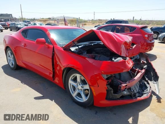 ✅ 2021 Chevrolet Camaro 1LS • VIN: 1G1FB1RX1M0124089 • Lot: 41984274. Listed on IAAI with 53,947 mi. Free auction sales archive from the USA and detailed vehicle history report at DreamBid. Image 1.
