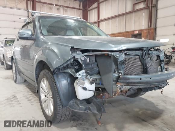✅ 2012 Subaru Forester X Touring • VIN: JF2SHAHC1CH406270 • Lot: 42166953. Listed on IAAI with 144,843 mi. Free auction sales archive from the USA and detailed vehicle history report at DreamBid. Image 13.