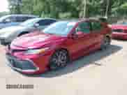 2022 Toyota Camry XLE z VIN 4T1F11AK9NU068628, wystawiony jako IAAI lot #42562631 z przebiegiem 54 264 mil mil oraz . Historia ofert i sprzedaży dostępna na DreamBid. Obrazek 2.