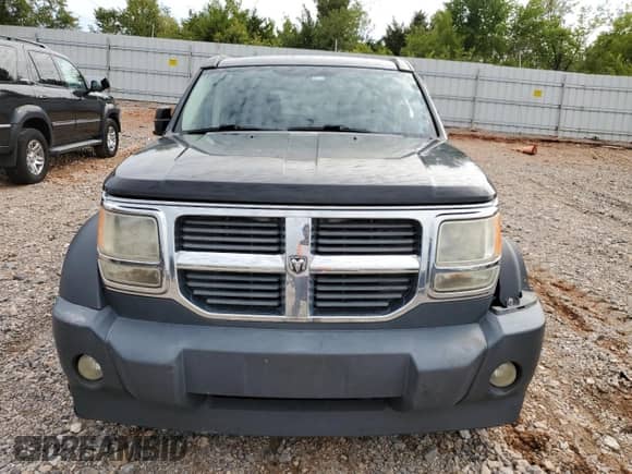 2007 Dodge Nitro SXT с VIN 1D8GU28K27W601732, выставлен на аукционе Copart как лот 72654904 с пробегом 123 249 миль миль и Списание • Salvage title. История ставок и продаж доступна на DreamBid. Изображение 5.