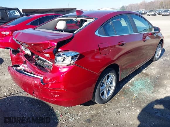 ✅ 2018 Chevrolet Cruze LT • VIN: 1G1BE5SM1J7213855 • Lot: 40998816. Listed on IAAI with 84,328 mi. Free auction sales archive from the USA and detailed vehicle history report at DreamBid. Image 4.