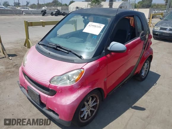✅ 2009 Smart fortwo Pure • VIN: WMEEJ31X89K247804 • Лот: 42998339. Опубликован ранее на IAAI с пробегом 126 234 миль. Бесплатный доступ к архиву аукционных продаж из США и подробный отчёт об истории автомобиля на DreamBid. Изображение 2.