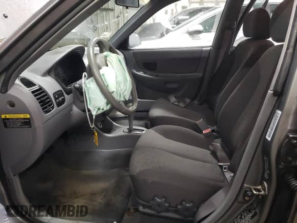 2004 Hyundai Accent GL with VIN KMHCG45C24U564570, listed as a Copart auction lot 82090484 with 69,000 mi miles and Salvage title. Bid and sale history available at DreamBid. Image 7.