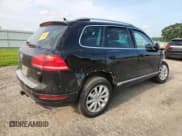 ✅ 2011 Volkswagen Touareg Sport • VIN: WVGFF9BP5BD000199 • Lot: 66759255. Listed on Copart with Not provided. Free auction sales archive from the USA and detailed vehicle history report at DreamBid. Image 3.