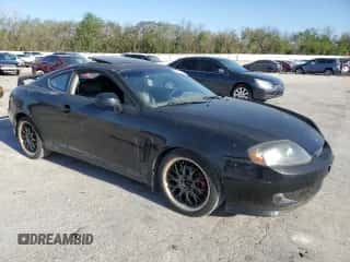 2006 Hyundai Tiburon GT с VIN KMHHN65F76U197234, выставлен на аукционе Copart как лот 52775705 с пробегом 127 581 миль миль и Чистый • Clean title. История ставок и продаж доступна на DreamBid. Изображение 4.