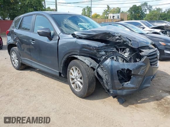 ✅ 2016 Mazda CX-5 Touring • VIN: JM3KE4CY3G0661445 • Лот: 43248250. Опубликован ранее на IAAI с пробегом 111 403 миль. Бесплатный доступ к архиву аукционных продаж из США и подробный отчёт об истории автомобиля на DreamBid. Изображение 1.