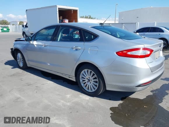 ✅ 2013 Ford Fusion SE Hybrid • VIN: 3FA6P0LU8DR262977 • Lot: 43729571. Listed on IAAI with 115,875 mi. Free auction sales archive from the USA and detailed vehicle history report at DreamBid. Image 3.