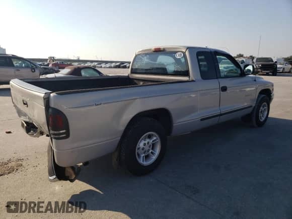 1999 Dodge Dakota SLT z VIN 1B7GL22X0XS315391, wystawiony jako Copart lot #75209904 z przebiegiem 181 336 mil mil oraz Szkoda całkowita • Salvage title. Historia ofert i sprzedaży dostępna na DreamBid. Obrazek 3.