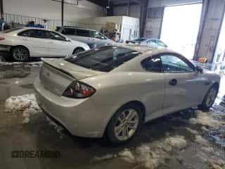2008 Hyundai Tiburon GS z VIN KMHHM66D68U292449, wystawiony jako Copart lot #86752214 z przebiegiem 251 711 mil mil oraz Szkoda całkowita • Salvage title. Historia ofert i sprzedaży dostępna na DreamBid. Obrazek 3.