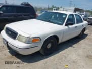 ✅ 2000 Ford Crown Victoria Police Interceptor • VIN: 2FAFP71W9YX208897 • Лот: 42597305. Опубликован ранее на IAAI с пробегом 128 699 миль. Бесплатный доступ к архиву аукционных продаж из США и подробный отчёт об истории автомобиля на DreamBid. Изображение 2.