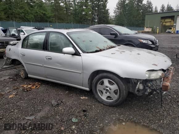 2003 Chevrolet Malibu LS with VIN 1G1NE52J33M604691, listed as a Copart auction lot 84902294 with Not provided miles and Salvage title. Bid and sale history available at DreamBid. Image 4.