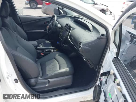 2021 Toyota Prius L Eco with VIN JTDKAMFU9M3136865, listed as a IAAI auction lot 42476212 with 16,961 mi miles and . Bid and sale history available at DreamBid. Image 5.