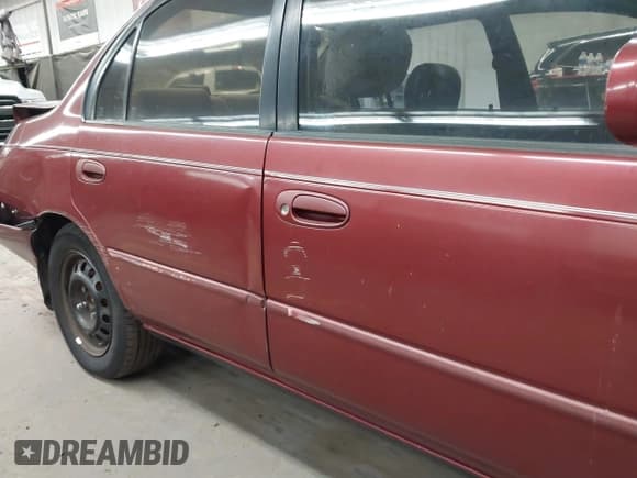 ✅ 1997 Toyota Corolla DX • VIN: 1NXBB02E2VZ601840 • Lot: 43774906. Listed on IAAI with 169,903 mi. Free auction sales archive from the USA and detailed vehicle history report at DreamBid. Image 12.