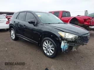 ✅ 2015 Mazda CX-5 Grand Touring • VIN: JM3KE2DY3F0479133 • Lot: 42297019. Wystawiony na IAAI z przebiegiem 152 669 mil. Bezpłatny archiwum sprzedaży aukcyjnych z USA i szczegółowy raport historii pojazdu na DreamBid. Zdjęcie 1.