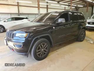 2018 Jeep Grand Cherokee Trailhawk with VIN 1C4RJFLTXJC298893, listed as a Copart auction lot 82237605 with 141,586 mi miles and Salvage title. Bid and sale history available at DreamBid. Image 1.
