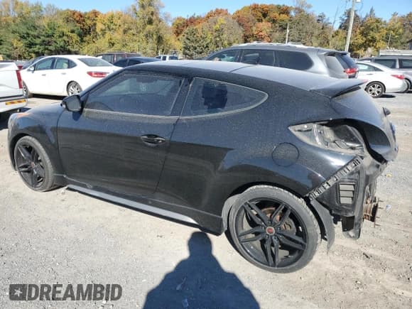 ✅ 2013 Hyundai Veloster Turbo • VIN: KMHTC6AEXDU129004 • Lot: 77096014. Wystawiony na Copart z przebiegiem 83 418 mil. Bezpłatny archiwum sprzedaży aukcyjnych z USA i szczegółowy raport historii pojazdu na DreamBid. Zdjęcie 2.