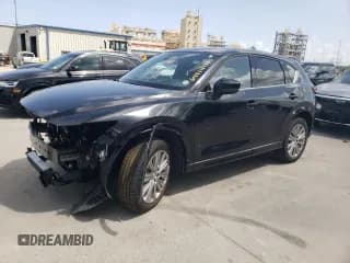 ✅ 2023 Mazda CX-5 Signature • VIN: JM3KFBXY1P0231831 • Lot: 64414485. Listed on Copart with 11,138 mi. Free auction sales archive from the USA and detailed vehicle history report at DreamBid. Image 1.