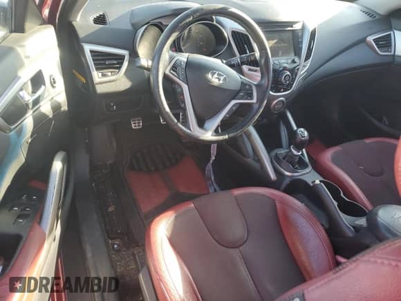 2012 Hyundai Veloster w/Red Int z VIN KMHTC6AD9CU084434, wystawiony jako Copart lot #83387244 z przebiegiem 177 841 mil mil oraz Czysty tytuł • Clean title. Historia ofert i sprzedaży dostępna na DreamBid. Obrazek 8.