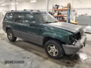 ✅ 1996 Jeep Grand Cherokee Laredo • VIN: 1J4GZ58S9TC198257 • Lot: 93327175. Listed on Copart with 169,183 mi. Free auction sales archive from the USA and detailed vehicle history report at DreamBid. Image 4.