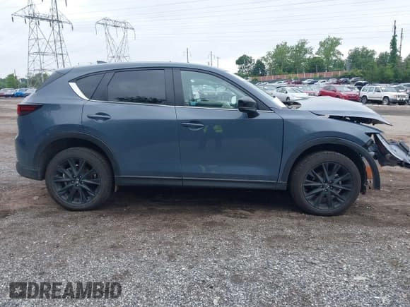 ✅ 2023 Mazda CX-5 S Carbon Edition • VIN: JM3KFBCM4P0142175 • Lot: 42523647. Listed on IAAI with 48,655 mi. Free auction sales archive from the USA and detailed vehicle history report at DreamBid. Image 14.