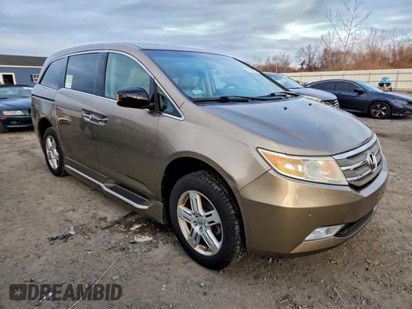 ✅ 2012 Honda Odyssey Touring • VIN: 5FNRL5H95CB004484 • Lot: 96341915. Listed on Copart with 123,591 mi. Free auction sales archive from the USA and detailed vehicle history report at DreamBid. Image 4.