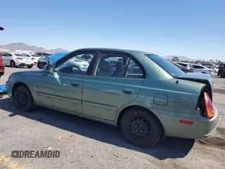 2005 Hyundai Accent GLS z VIN KMHCG45CX5U609093, wystawiony jako Copart lot #81697905 z przebiegiem 144 055 mil mil oraz Szkoda całkowita • Salvage title. Historia ofert i sprzedaży dostępna na DreamBid. Obrazek 2.