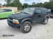 2005 Chevrolet Blazer LS z VIN 1GNCT18X25K105119, wystawiony jako Copart lot #65774865 z przebiegiem 249 842 mil mil oraz Szkoda całkowita • Salvage title. Historia ofert i sprzedaży dostępna na DreamBid. Obrazek 1.