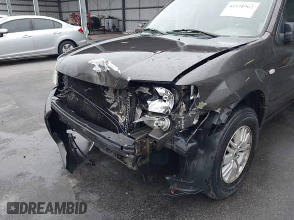 2005 Mercury Mariner Luxury z VIN 4M2YU56195DJ14917, wystawiony jako IAAI lot #41538962 z przebiegiem 210 486 mil mil oraz . Historia ofert i sprzedaży dostępna na DreamBid. Obrazek 6.