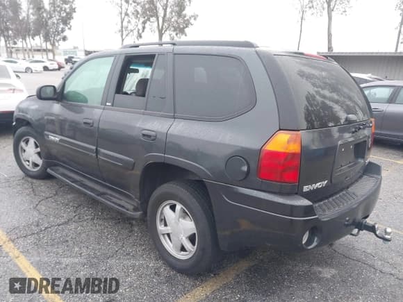 ✅ 2003 GMC Envoy SLE • VIN: 1GKDS13SX32371727 • Lot: 41569398. Listed on IAAI with 86,395 mi. Free auction sales archive from the USA and detailed vehicle history report at DreamBid. Image 3.