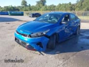 ✅ 2023 Kia Forte GT-Line • VIN: 3KPF54AD2PE525700 • Lot: 43439794. Listed on IAAI with 33,099 mi. Free auction sales archive from the USA and detailed vehicle history report at DreamBid. Image 2.