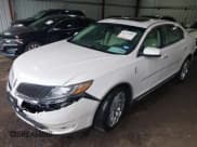 ✅ 2014 Lincoln MKS • VIN: 1LNHL9EK6EG610049 • Lot: 42438806. Listed on IAAI with 124,099 mi. Free auction sales archive from the USA and detailed vehicle history report at DreamBid. Image 2.