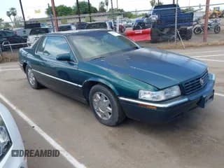 ✅ 1998 Cadillac Eldorado Touring • VIN: 1G6ET1290WU606076 • Лот: 42004118. Опубликован ранее на IAAI с пробегом 103 860 миль. Бесплатный доступ к архиву аукционных продаж из США и подробный отчёт об истории автомобиля на DreamBid. Изображение 1.