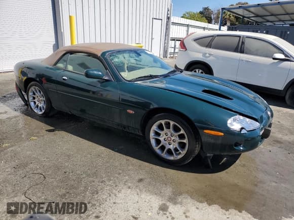 ✅ 2000 Jaguar XK • VIN: SAJJA42B5YPA06990 • Лот: 64503875. Опубликован ранее на Copart с пробегом Не указан. Бесплатный доступ к архиву аукционных продаж из США и подробный отчёт об истории автомобиля на DreamBid. Изображение 4.