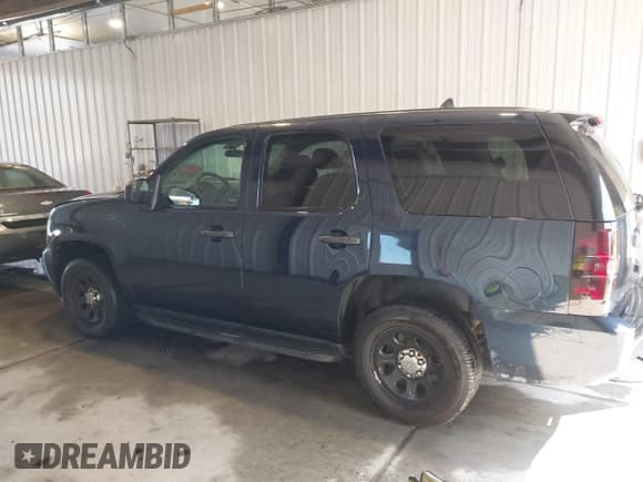 ✅ 2014 Chevrolet Tahoe Commercial • VIN: 1GNLC2E07ER213191 • Lot: 43243599. Listed on IAAI with 141,185 mi. Free auction sales archive from the USA and detailed vehicle history report at DreamBid. Image 13.