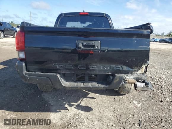 ✅ 2023 Toyota Tacoma SR • VIN: 3TYRX5GN9PT067936 • Lot: 81896565. Listed on Copart with 84,619 mi. Free auction sales archive from the USA and detailed vehicle history report at DreamBid. Image 6.